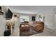 Comfortable living room with stylish decor, including an oversized couch, area rug, and modern entertainment center at 12020 W Alabama Pl, Lakewood, CO 80228