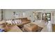 Inviting living room with comfortable seating, open layout, and seamless access to the modern kitchen and dining area at 12020 W Alabama Pl, Lakewood, CO 80228