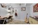 Office space with desk, chair, guitars hanging on the wall, and a unique area rug at 12020 W Alabama Pl, Lakewood, CO 80228