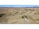 Expansive aerial view of fenced acreage with outbuildings, lush landscaping and mountain views at 2610 W County Road 4, Berthoud, CO 80513