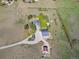 Expansive aerial view of private property with well-maintained landscaping, outbuildings, and a long driveway at 2610 W County Road 4, Berthoud, CO 80513