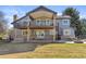 Two story home with outdoor living on two levels, plus hot tub, brick patio and firepit at 2610 W County Road 4, Berthoud, CO 80513
