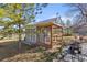 Well-maintained chicken coop with screened enclosure and charming weather vane at 2610 W County Road 4, Berthoud, CO 80513