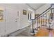 Bright entryway featuring a staircase, large windows, and hardwood floors at 2610 W County Road 4, Berthoud, CO 80513