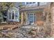 Welcoming front porch with seating, brick pillars, and a beautifully landscaped garden at 2610 W County Road 4, Berthoud, CO 80513