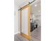 Convenient laundry room with sliding barn door and modern washer/dryer at 2610 W County Road 4, Berthoud, CO 80513
