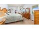 Light and airy main bedroom featuring rustic wood furniture and generous views of the surrounding property at 2610 W County Road 4, Berthoud, CO 80513