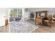 Comfortable home office boasts hardwood floors, rocking chairs, work station and access to backyard deck at 2610 W County Road 4, Berthoud, CO 80513