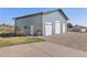 Outbuilding with three garage doors, plus a standard door and windows on a spacious lot at 2610 W County Road 4, Berthoud, CO 80513
