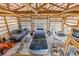 Interior view of outbuilding with high ceilings, three garage doors and ample storage space at 2610 W County Road 4, Berthoud, CO 80513