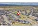 Aerial view of the community, complete with mountain views and a nearby park at 6521 Barnstead Dr, Castle Pines, CO 80108