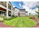 Spacious backyard featuring a well-maintained lawn, landscaping, and a wooden fence at 6521 Barnstead Dr, Castle Pines, CO 80108