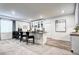 Finished basement bar area with white cabinets, tile backsplash, and luxury vinyl plank flooring at 6521 Barnstead Dr, Castle Pines, CO 80108