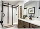 Contemporary bathroom featuring a glass shower and modern vanity at 6521 Barnstead Dr, Castle Pines, CO 80108