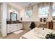 Elegant bathroom featuring a soaking tub, vanity, and stylish fixtures at 6521 Barnstead Dr, Castle Pines, CO 80108