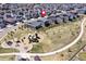 Bird's eye view of the neighborhood highlighting green spaces, a playground, and walking paths at 6521 Barnstead Dr, Castle Pines, CO 80108