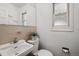 Small bathroom featuring modern sink and toilet at 2448 S Leyden St, Denver, CO 80222