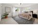 Bright bedroom featuring a large window, a cozy rug, and contemporary decor for a relaxing ambiance at 2448 S Leyden St, Denver, CO 80222
