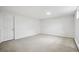 Spacious bedroom with a neutral carpet and a door leading to other parts of the house at 2448 S Leyden St, Denver, CO 80222