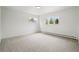 Sunlit, carpeted bedroom featuring two windows providing bright natural light at 2448 S Leyden St, Denver, CO 80222