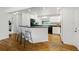 Eat-in kitchen with modern appliances and breakfast bar at 2448 S Leyden St, Denver, CO 80222