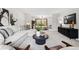 Inviting living room featuring modern decor, plush seating, and an expansive view of the landscaped yard at 2448 S Leyden St, Denver, CO 80222
