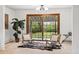 Cozy sitting area with stylish chairs, accent rug, and a sliding glass door that provides natural light at 2448 S Leyden St, Denver, CO 80222