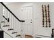 View of staircase and front door at 2448 S Leyden St, Denver, CO 80222