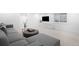 Finished basement featuring modern gray sectional and recessed lighting at 265 S Monroe St, Denver, CO 80209