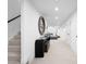 Finished basement hallway with black accent wall, storage, and recessed lighting at 265 S Monroe St, Denver, CO 80209