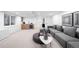 Basement living room with a modern gray couch, wet bar, and recessed lighting at 265 S Monroe St, Denver, CO 80209