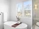 Bright bathroom featuring a soaking tub and view at 265 S Monroe St, Denver, CO 80209