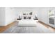 Comfortable bedroom with a large rug and balcony access, perfect for relaxation at 265 S Monroe St, Denver, CO 80209