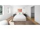 Bright bedroom featuring modern decor, neutral tones, and hardwood floors at 265 S Monroe St, Denver, CO 80209