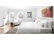 Bright bedroom featuring three windows, neutral tones, and stylish decor at 265 S Monroe St, Denver, CO 80209
