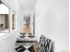 Elegant hallway with black and white marble flooring, leading to bright, open spaces at 265 S Monroe St, Denver, CO 80209