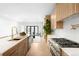 Bright, modern kitchen with white countertops, stainless steel appliances, and an open view to the living area at 265 S Monroe St, Denver, CO 80209