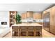 Modern kitchen features a center island with seating, stainless steel appliances, and ample counter space at 265 S Monroe St, Denver, CO 80209