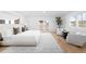 Spacious main bedroom featuring a balcony, seating area, and abundant natural light at 265 S Monroe St, Denver, CO 80209