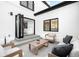 Stylish outdoor patio with modern furniture and open access to the interior at 265 S Monroe St, Denver, CO 80209