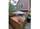Backyard with wooden patio and table with an umbrella at 1240 S Flower Cir # A, Lakewood, CO 80232