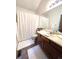 Clean and bright bathroom with a shower, vanity, and modern fixtures at 1240 S Flower Cir # A, Lakewood, CO 80232