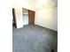 Bright bedroom with closet and neutral colored walls and flooring at 1240 S Flower Cir # A, Lakewood, CO 80232