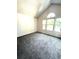 Bright bedroom features vaulted ceiling, three windows and neutral colored walls at 1240 S Flower Cir # A, Lakewood, CO 80232