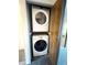 Laundry closet with stacked washer and dryer at 1240 S Flower Cir # A, Lakewood, CO 80232