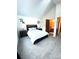 Spacious main bedroom with a comfortable bed, ensuite bathroom, and plenty of natural light at 1240 S Flower Cir # A, Lakewood, CO 80232