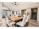 Dining area with a wood table and modern light fixture at 2008 Galapago, Denver, CO 80223