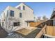 Modern home exterior with gray siding and a wooden fence at 2008 Galapago, Denver, CO 80223