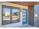 Modern front entrance with a blue door and sleek windows at 2008 Galapago, Denver, CO 80223