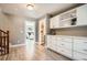 Spacious hallway with built-in storage and a view of a bedroom at 2008 Galapago, Denver, CO 80223